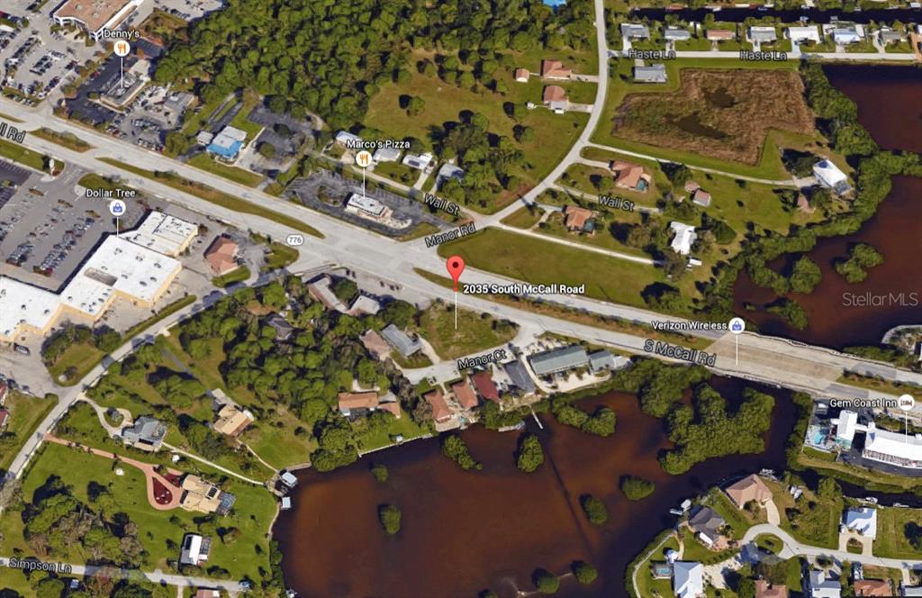 2035 South McCall Road Englewood, FL 34223 - Photo 9 of 17 an aerial view of a residential building