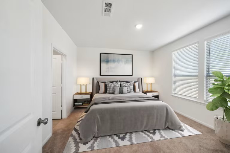 25478 Multiflora Drive Magnolia, TX 77355 - Photo 5 of 10 a bedroom with a large bed and a window