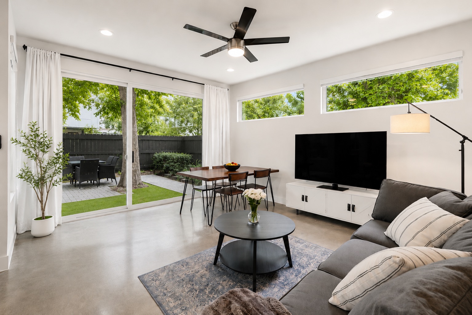 1182 Ridgeway Drive, Unit A Austin, TX 78702 - Photo 9 of 35 a living room with furniture and a flat screen tv