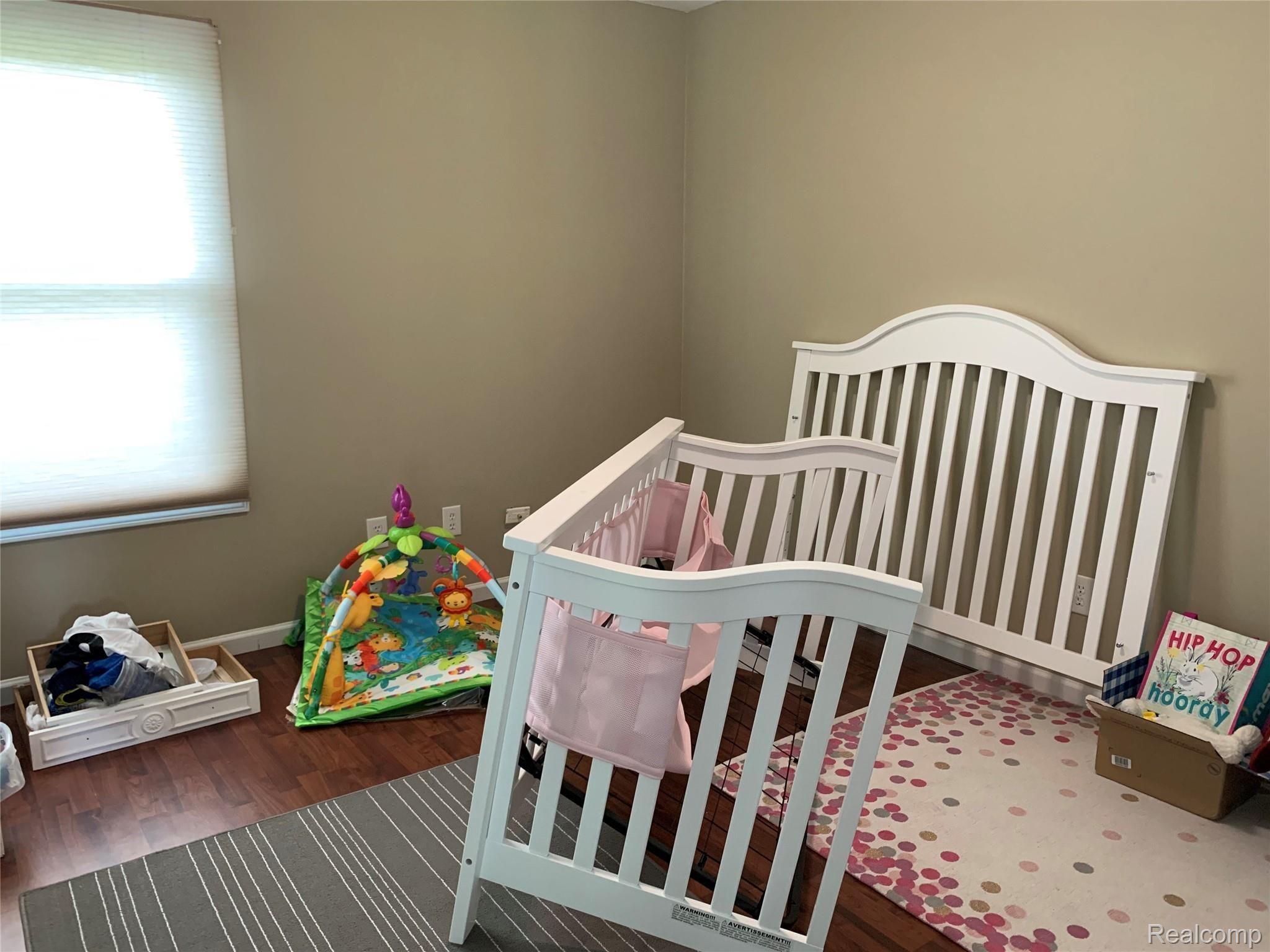 57260 12 Mile Road New Hudson, MI 48165 - Photo 17 of 22 upstairs bed2.jpg