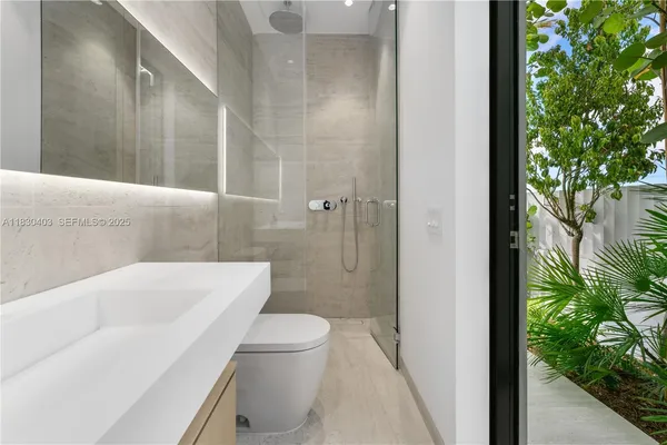 a bathroom with a toilet and a bathtub