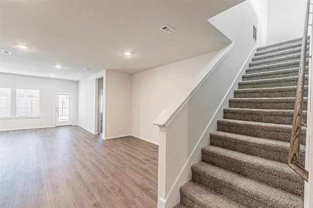 a view of an entryway with wooden floor