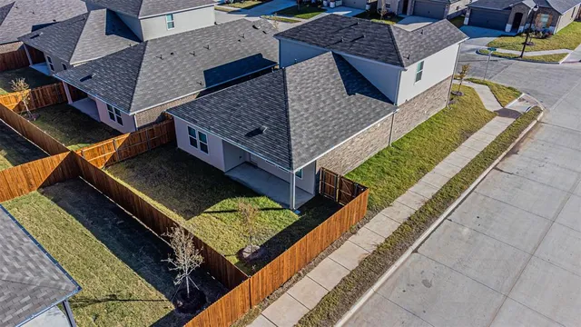 an aerial view of a house with a garden