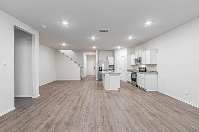 a view of kitchen with wooden floor