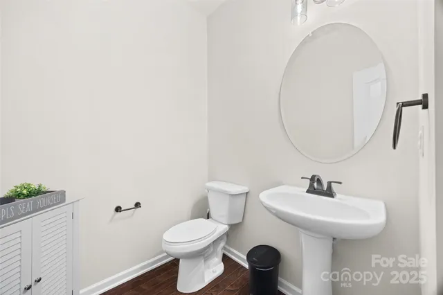 an empty room with a window and a ceiling fan