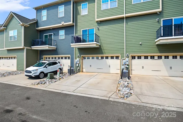 a car parked in front of a brick house