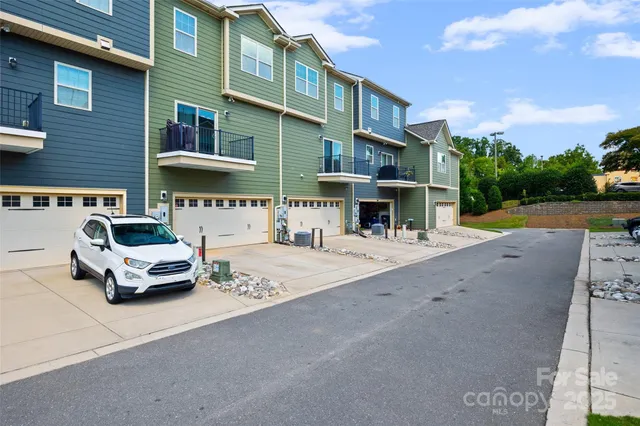 a view of a brick house with a sign broad