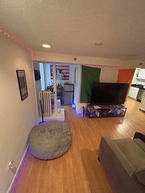 63 Hancock, Unit BR Boston, MA 02114 - Photo 1 of 12 a view of a livingroom with furniture