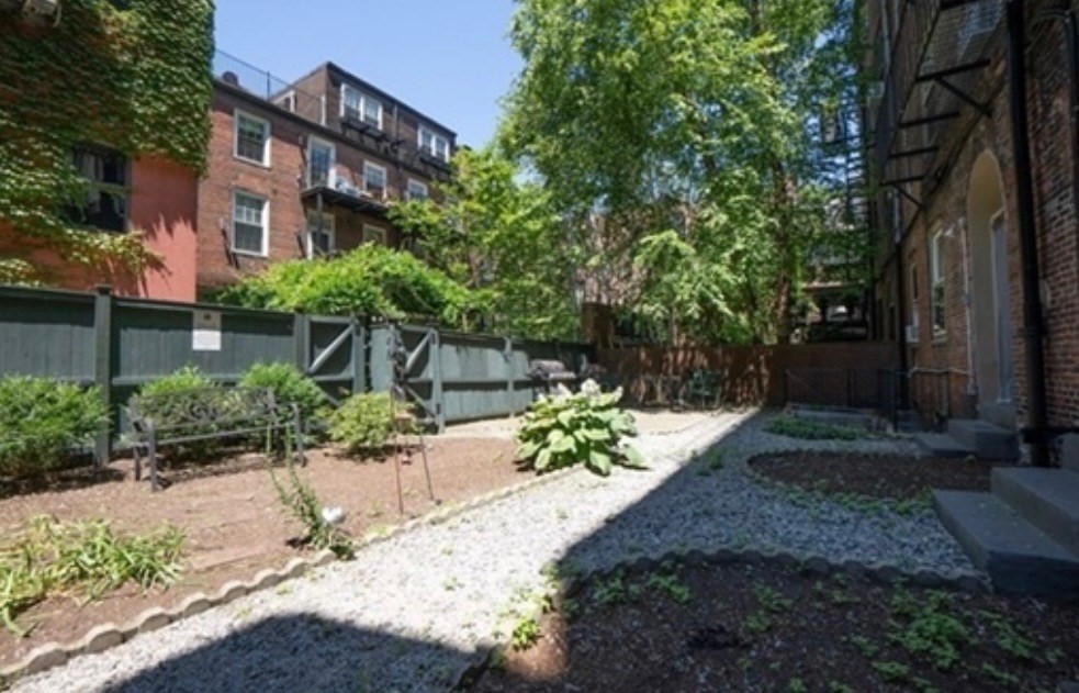 63 Hancock, Unit BR Boston, MA 02114 - Photo 11 of 12 a view of a pathway with a garden