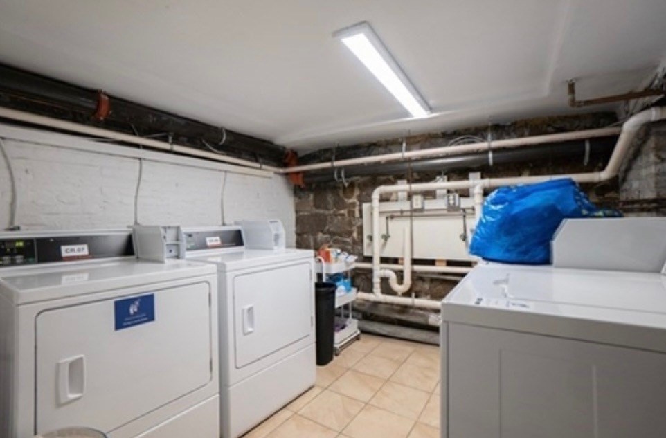 63 Hancock, Unit BR Boston, MA 02114 - Photo 10 of 12 a utility room with dryer and washer