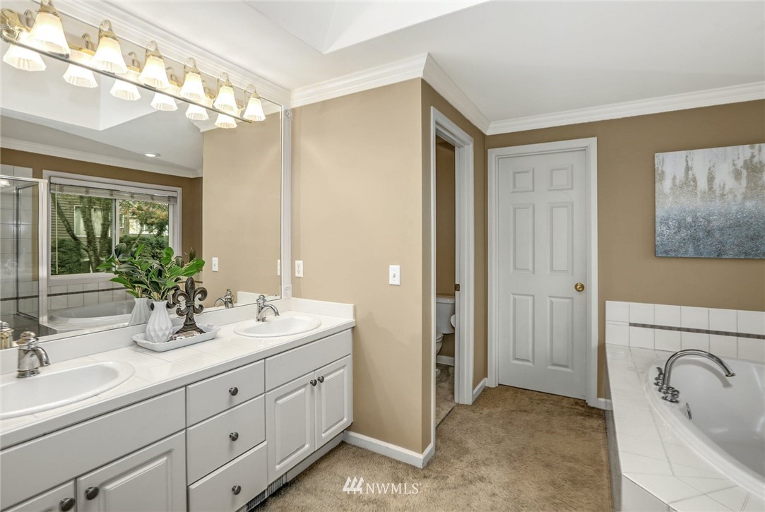 3933 208th Place Southeast Bothell, WA 98021 - Photo 22 of 40 a bathroom with a double vanity sink mirror and shower