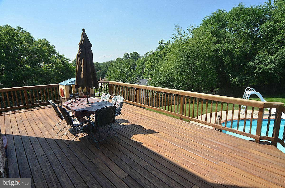 24719 Ridge Road Damascus, MD 20872 - Photo 7 of 30 Deck overlooking peaceful yard and pool
