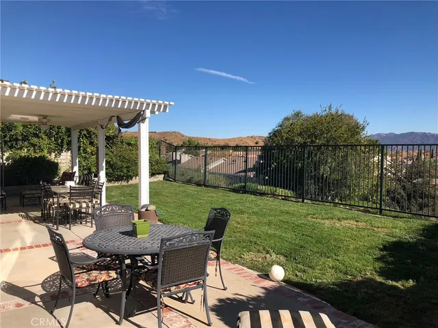 a view of yard with seating area and green space