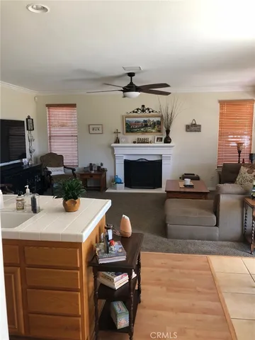 a kitchen with stainless steel appliances kitchen island granite countertop a stove and a sink