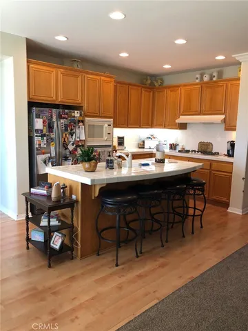 a kitchen with a table and chairs in it