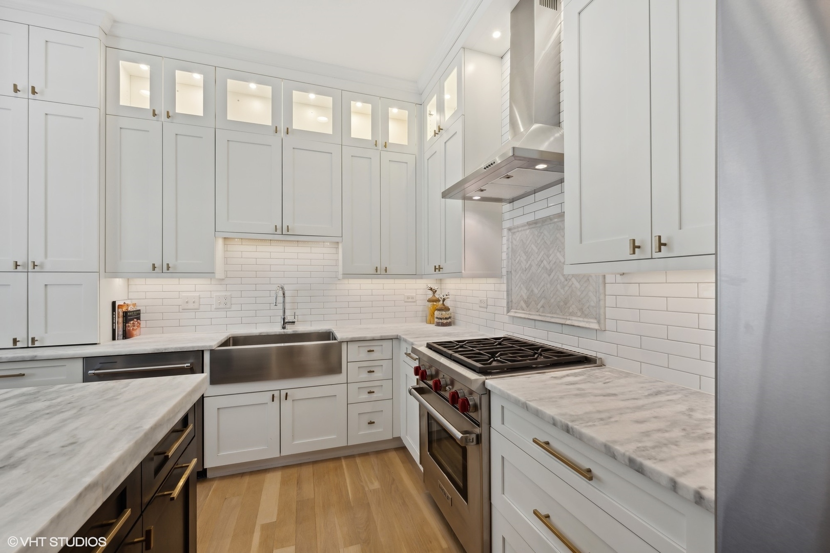 23 North Green Street, Unit 203 Chicago, IL 60607 - Photo 4 of 15 a kitchen with granite countertop white cabinets and white appliances