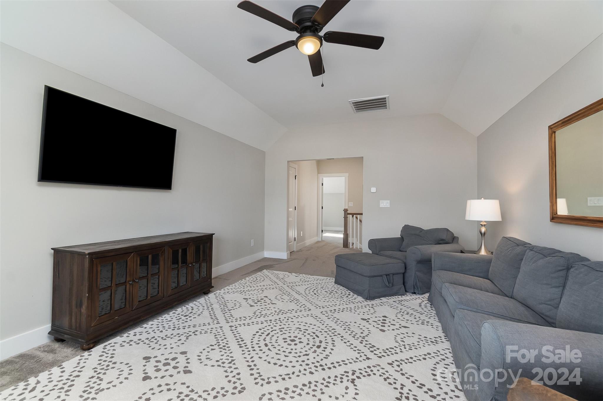 1222 Therns Ferry Drive Fort Mill, SC 29708 - Photo 16 of 35 a living room with furniture and a flat screen tv