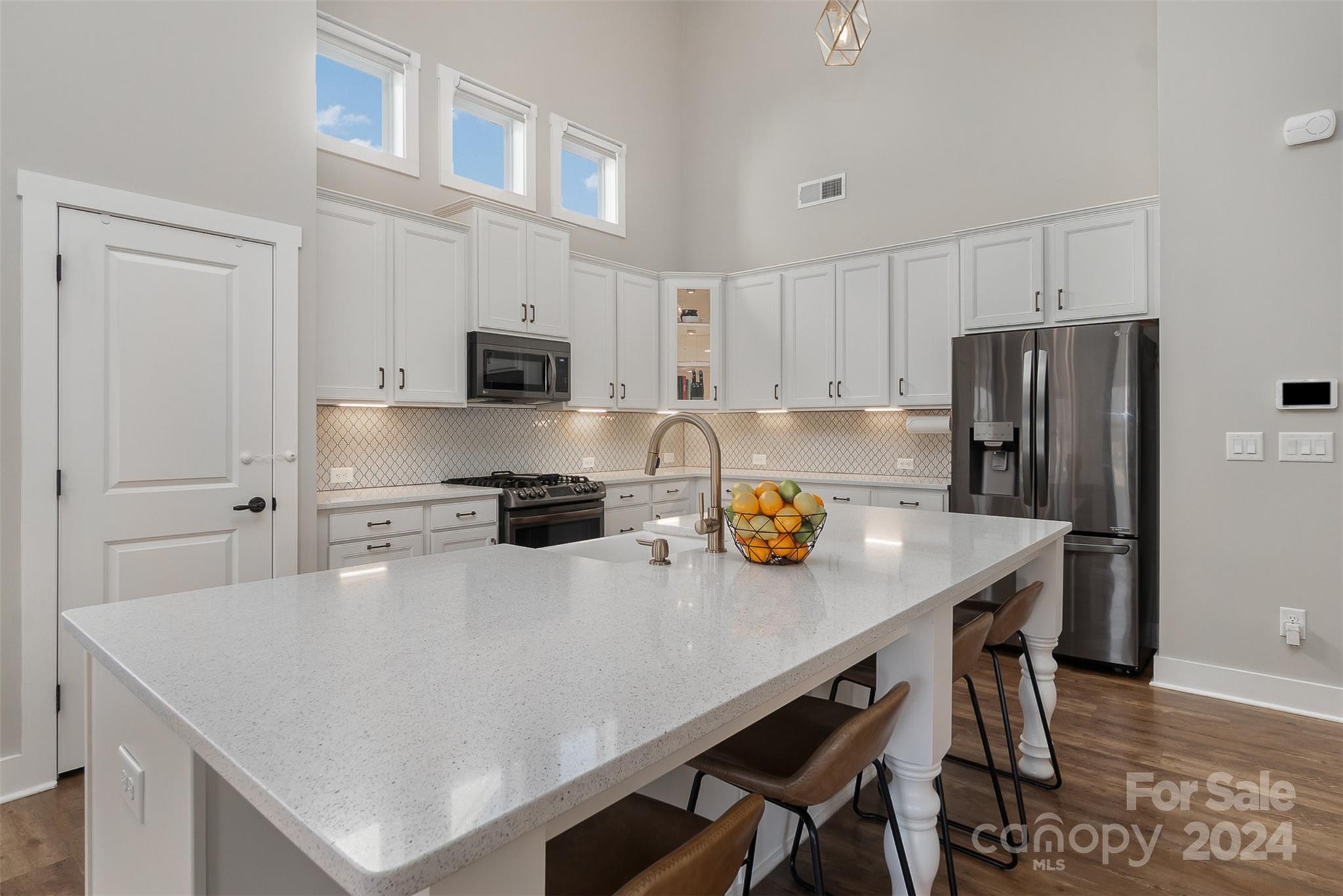 1222 Therns Ferry Drive Fort Mill, SC 29708 - Photo 17 of 35 a kitchen with stainless steel appliances a refrigerator and a stove top oven