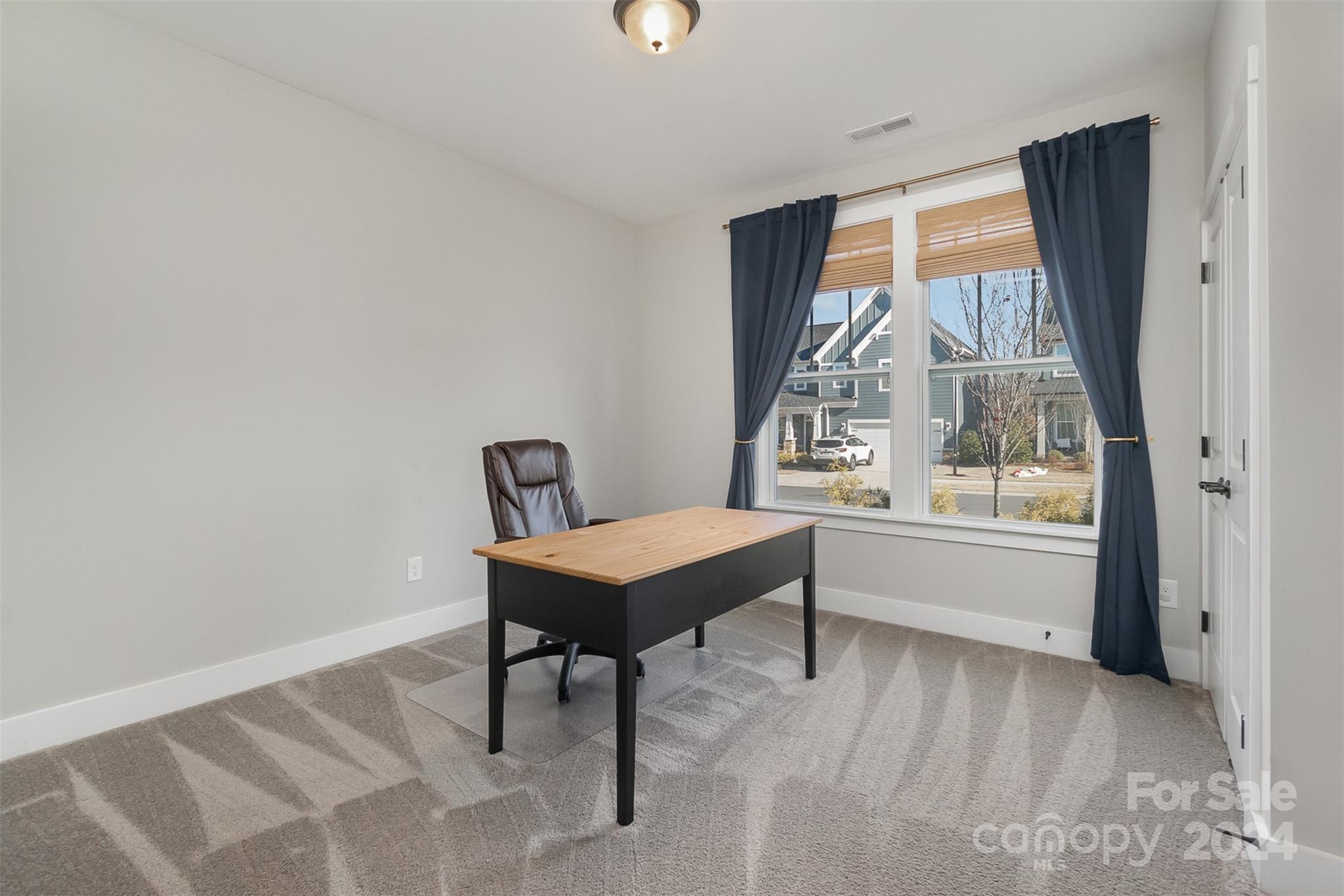 1222 Therns Ferry Drive Fort Mill, SC 29708 - Photo 7 of 35 a view of a workspace with furniture and a window