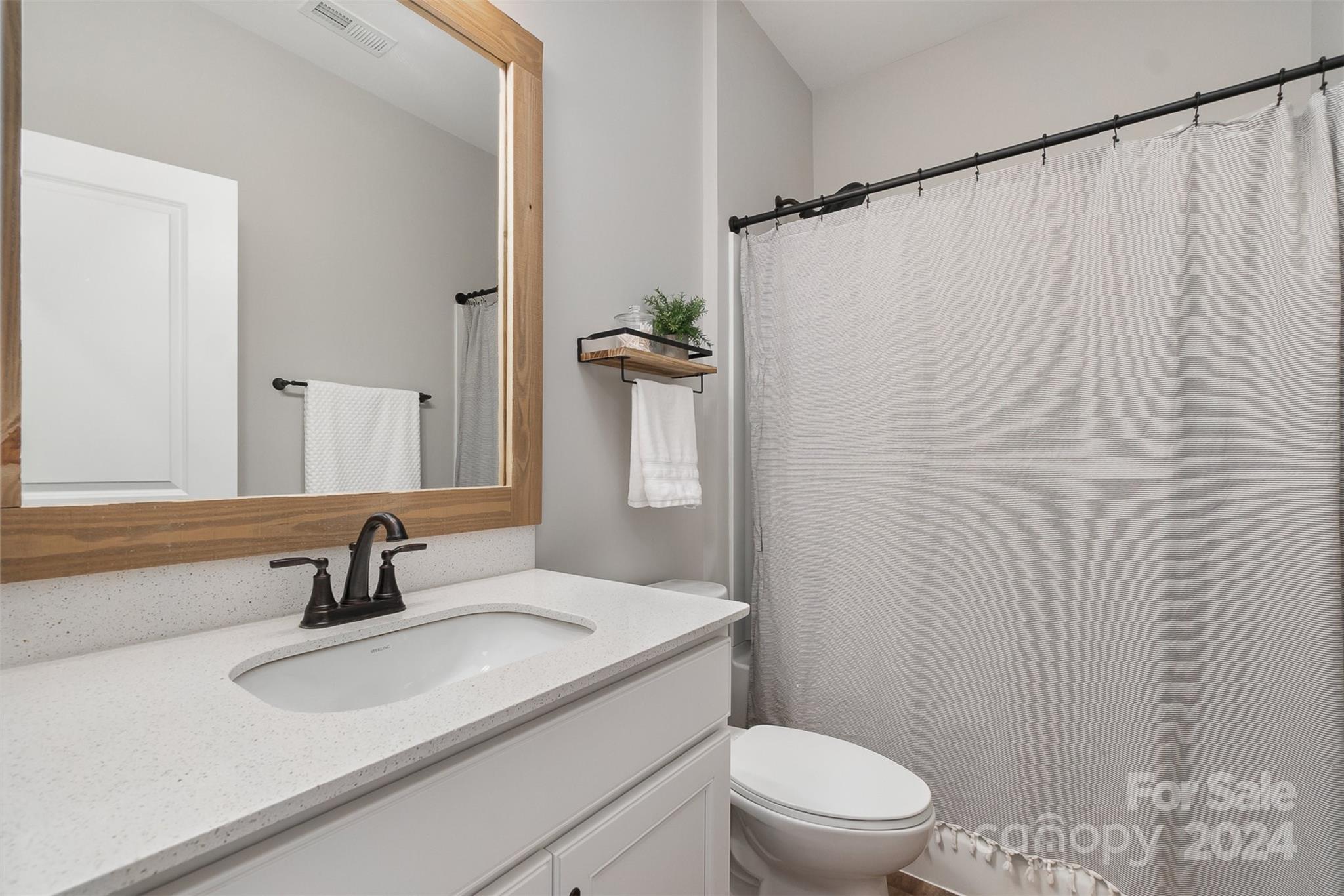 1222 Therns Ferry Drive Fort Mill, SC 29708 - Photo 8 of 35 a bathroom with a sink a toilet and shower