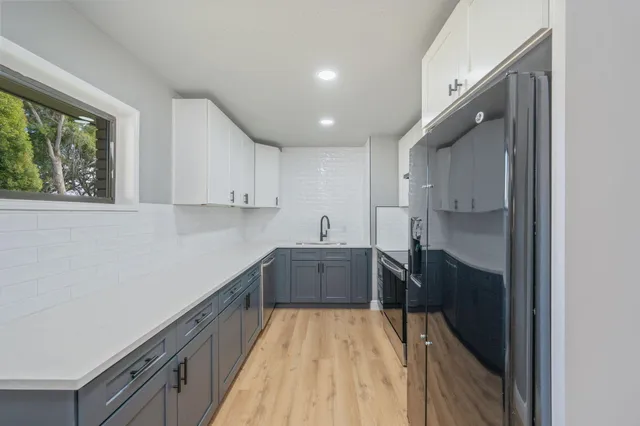 a kitchen with a sink and cabinets