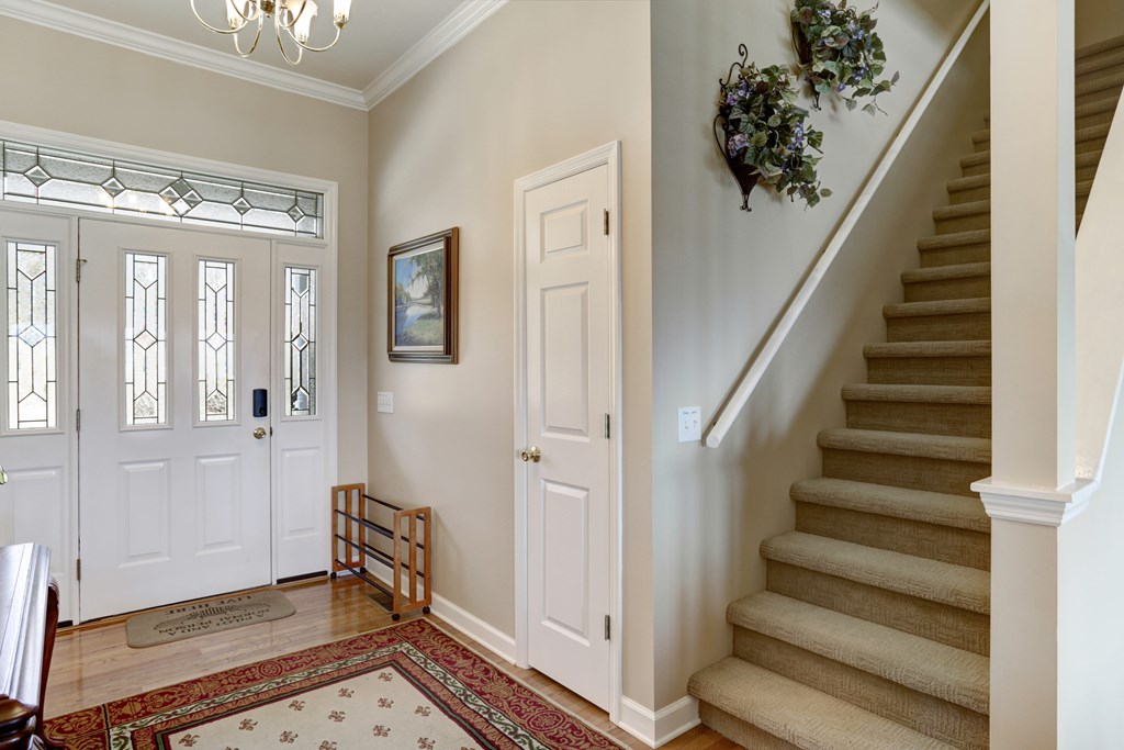 18 Foxfire Court Hayesville, NC 28904 - Photo 11 of 41 a view of entryway with stairs and wooden floor