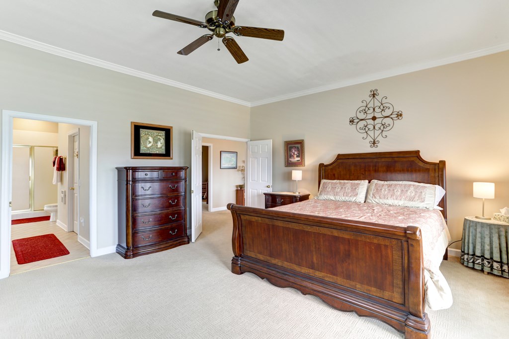 18 Foxfire Court Hayesville, NC 28904 - Photo 15 of 41 a bedroom with a bed and a chandelier