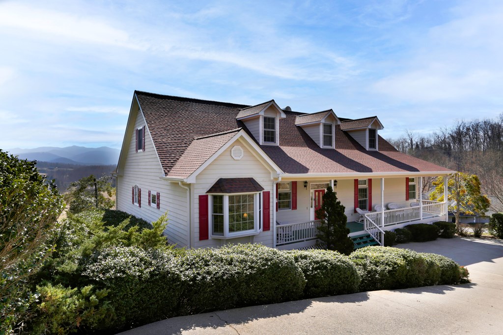 18 Foxfire Court Hayesville, NC 28904 - Photo 2 of 41 a front view of a house with a garden