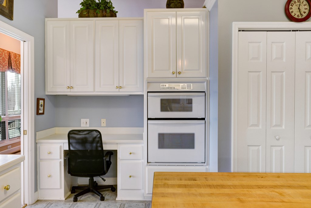 18 Foxfire Court Hayesville, NC 28904 - Photo 23 of 41 a kitchen with stainless steel appliances granite countertop a stove a microwave and a white cabinets