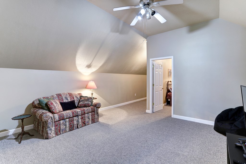 18 Foxfire Court Hayesville, NC 28904 - Photo 32 of 41 a living room with furniture and a chandelier