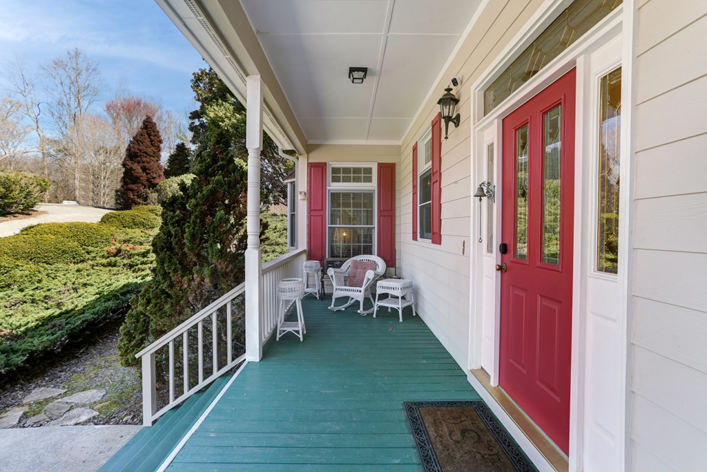 18 Foxfire Court Hayesville, NC 28904 - Photo 8 of 41 a balcony with wooden floor and outdoor seating