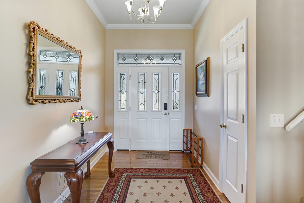 18 Foxfire Court Hayesville, NC 28904 - Photo 10 of 41 a very nice looking room with wooden floor and a chandelier