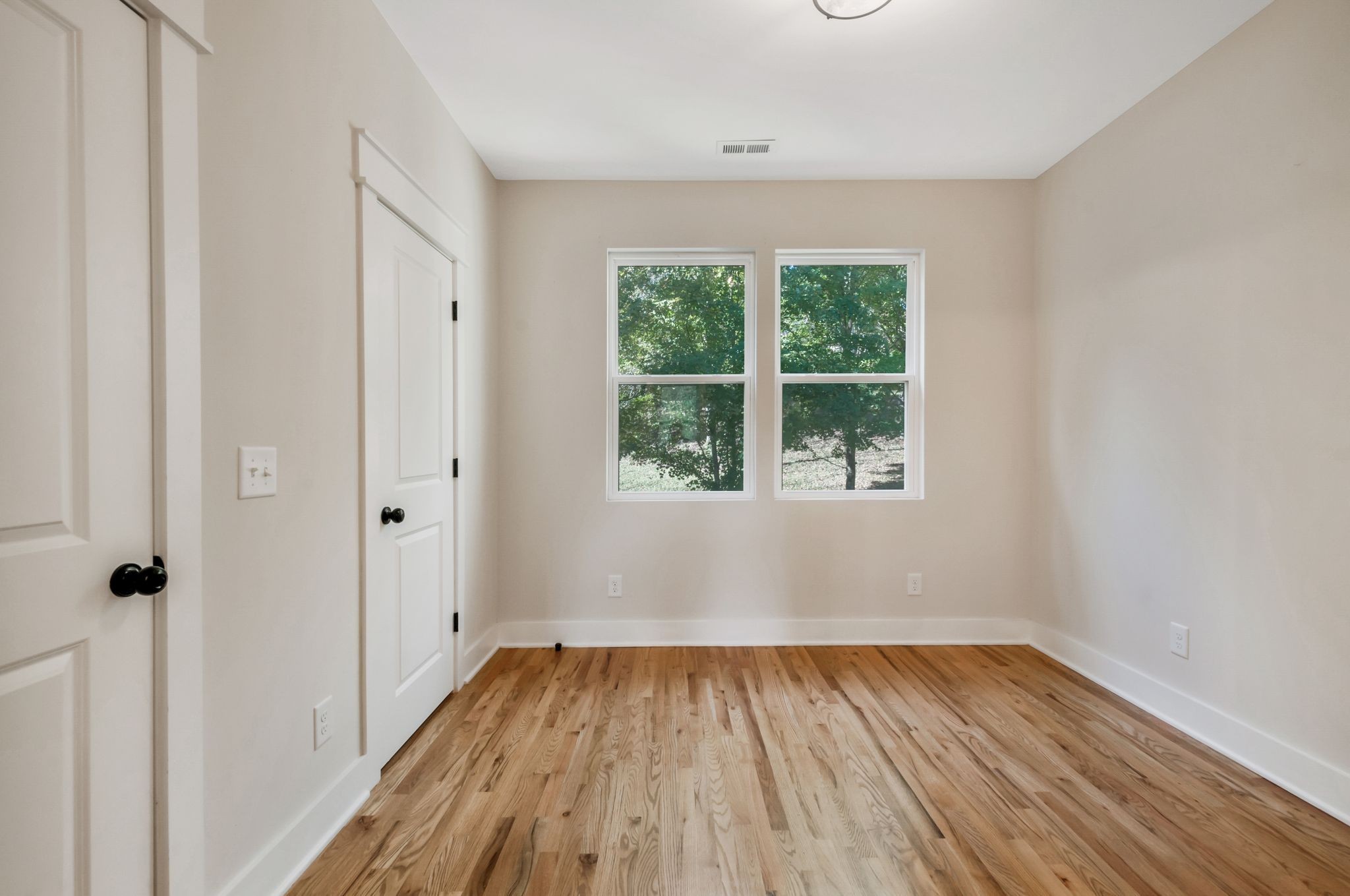 2005 Beaver Ridge Road White Bluff, TN 37187 - Photo 28 of 39 wooden floor in an empty room with a window