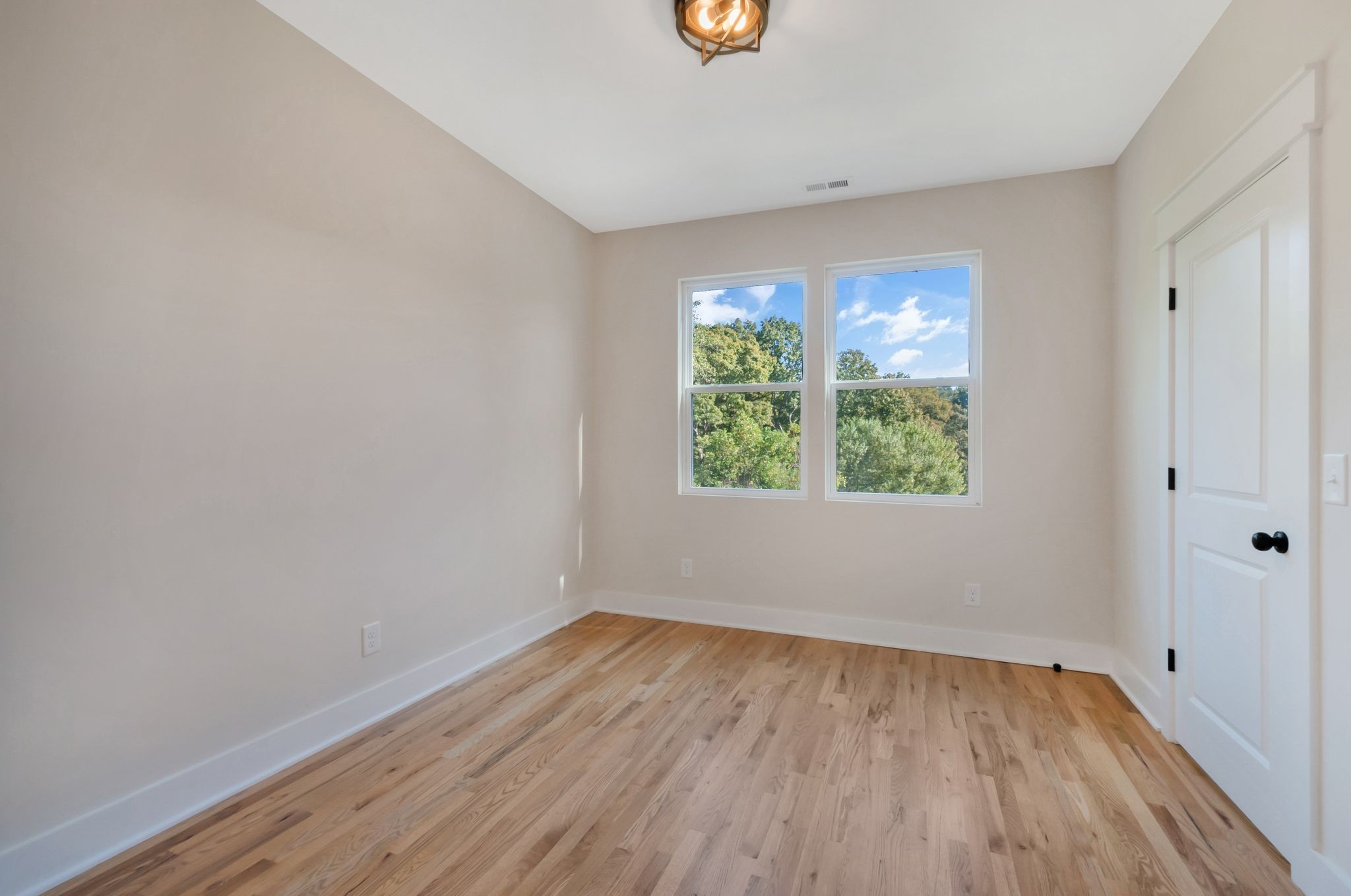 2005 Beaver Ridge Road White Bluff, TN 37187 - Photo 31 of 39 wooden floor in an empty room with a window
