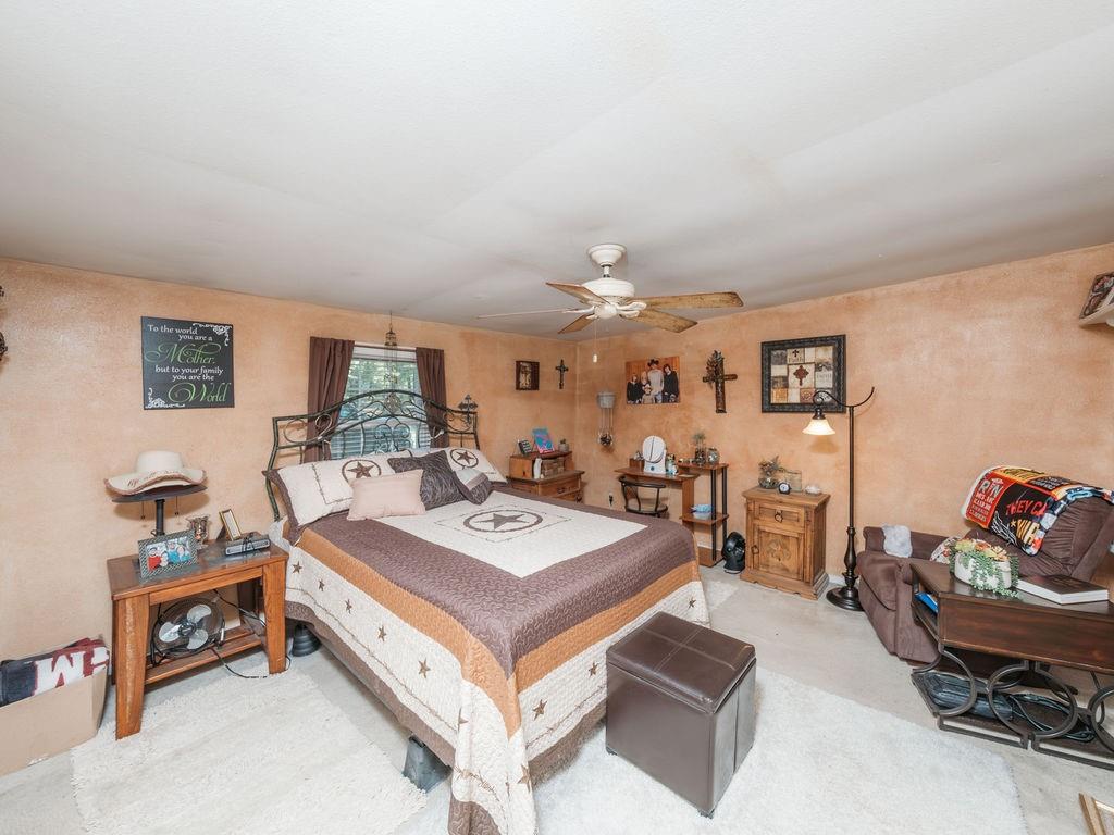 196 Perch Road Bowie, TX 76230 - Photo 14 of 30 a living room with furniture and a table