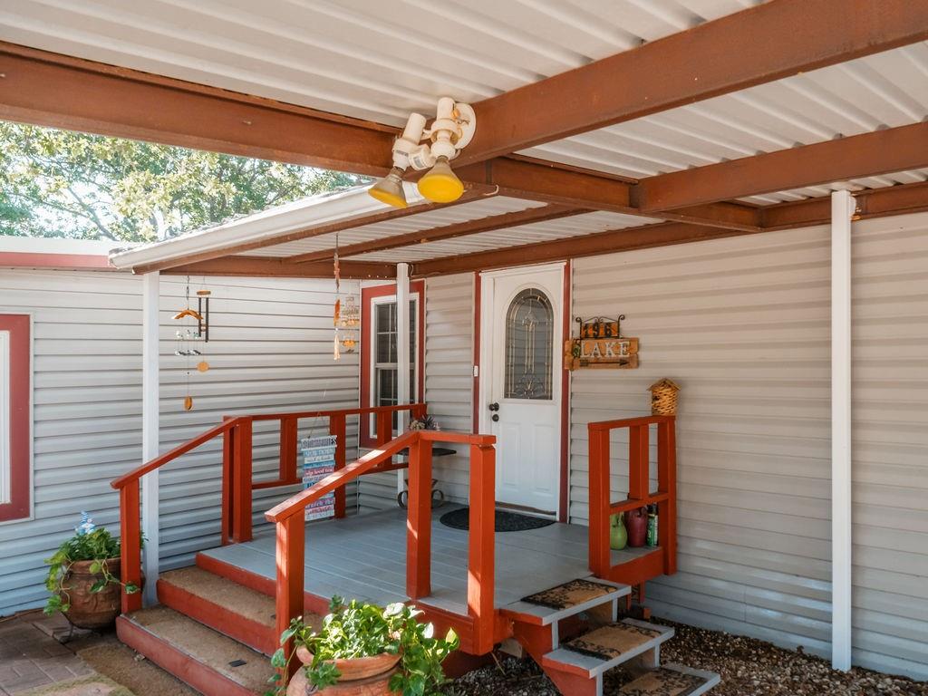 196 Perch Road Bowie, TX 76230 - Photo 2 of 30 a backyard of a house with seating space