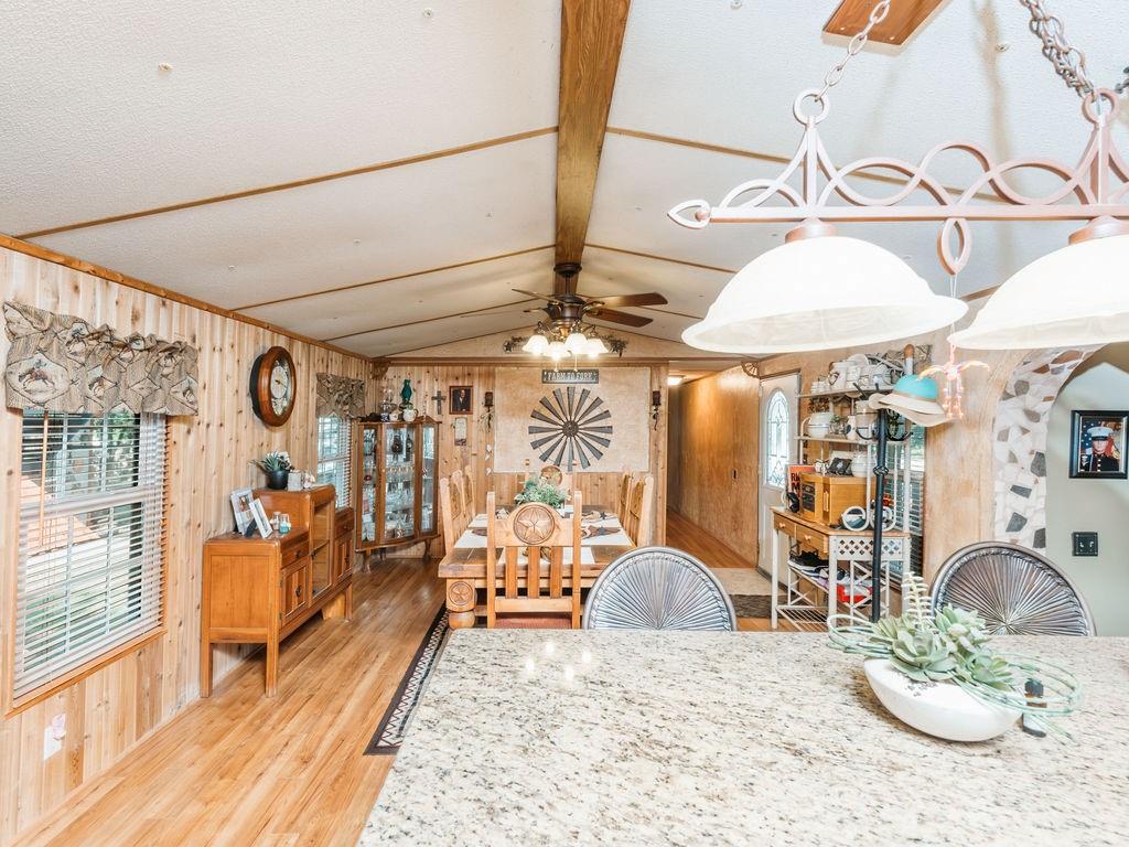 196 Perch Road Bowie, TX 76230 - Photo 6 of 30 a view of a livingroom with furniture and a chandelier