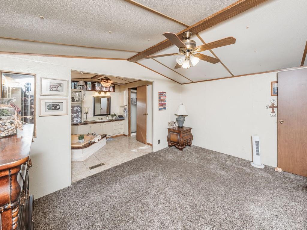 196 Perch Road Bowie, TX 76230 - Photo 10 of 30 a view of a livingroom with storage and utility