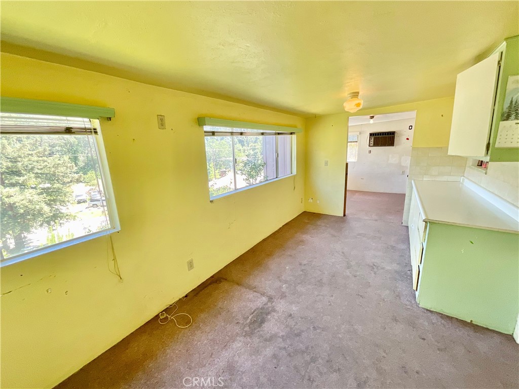 7282 Marin Street Nice, CA 95464 - Photo 60 of 69 a view of an empty room with a fireplace and a window