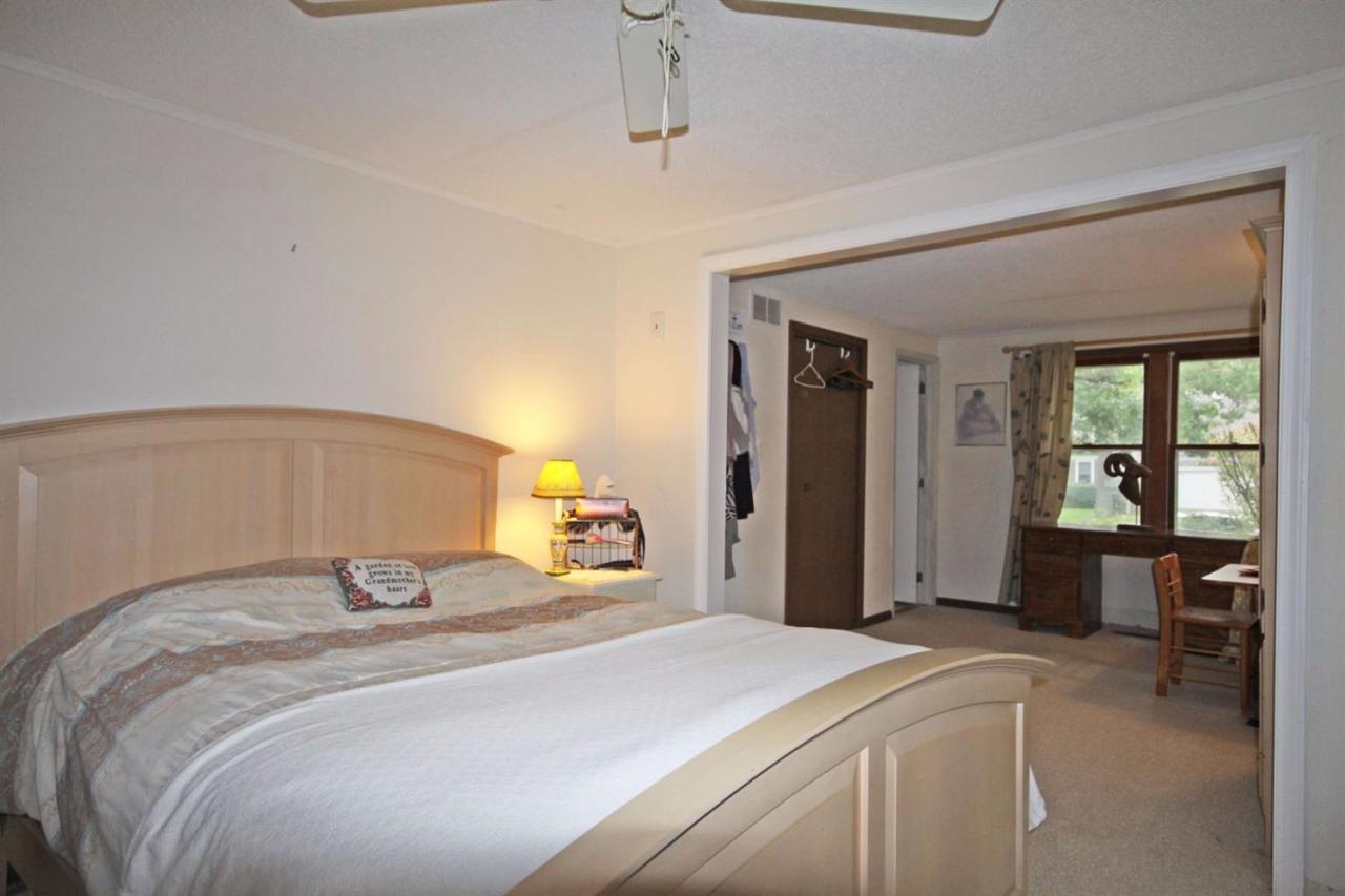 140 Captain Samadrus Road Cotuit, MA 02635 - Photo 12 of 18 a bedroom with a bed and window
