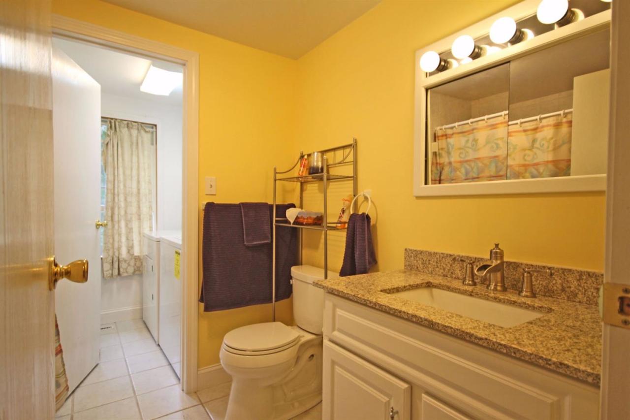 140 Captain Samadrus Road Cotuit, MA 02635 - Photo 14 of 18 a bathroom with a granite countertop sink toilet and shower