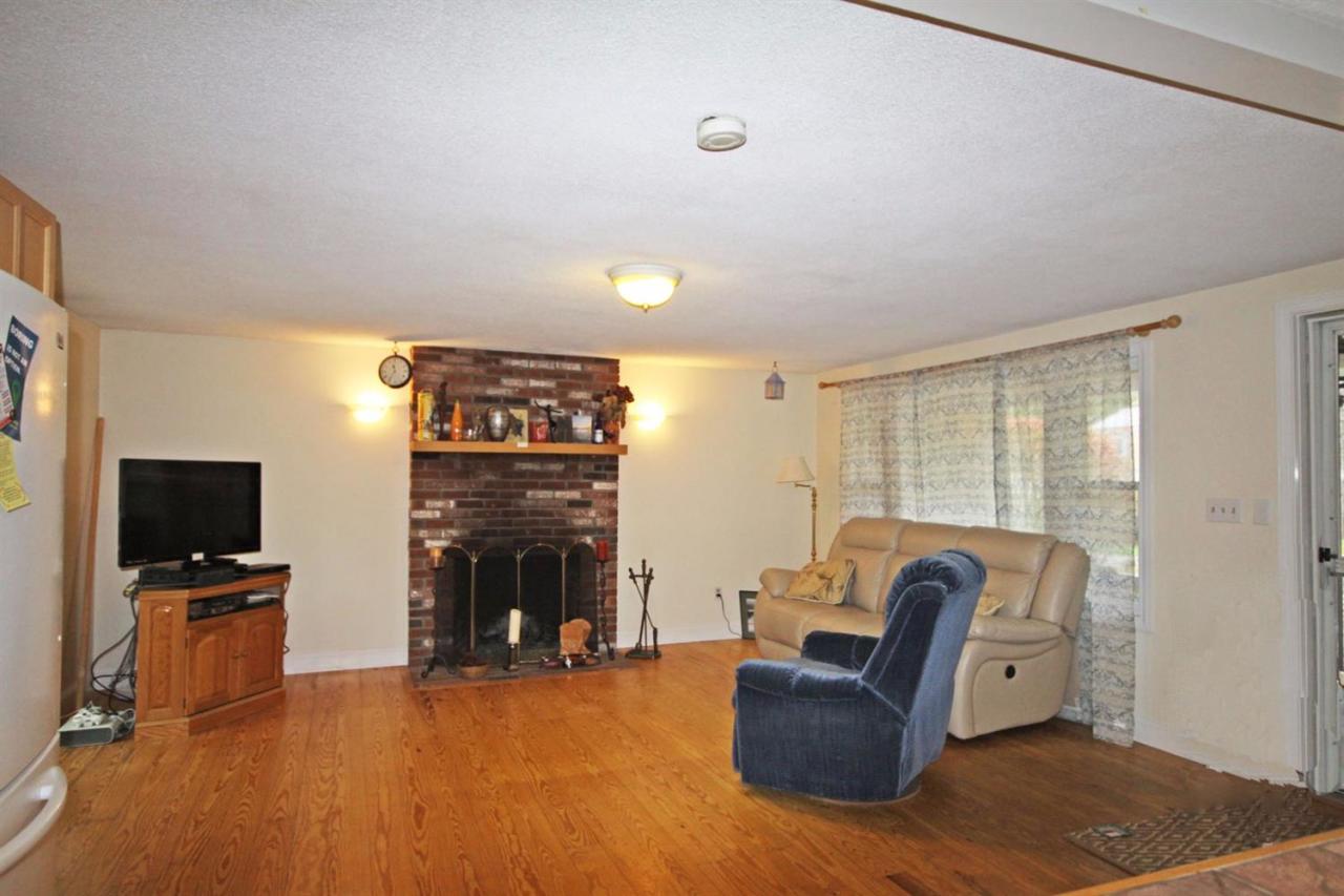 140 Captain Samadrus Road Cotuit, MA 02635 - Photo 3 of 18 a living room with furniture and a flat screen tv