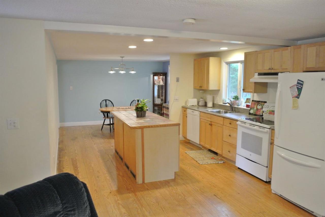 140 Captain Samadrus Road Cotuit, MA 02635 - Photo 8 of 18 a utility room with cabinets washer and dryer