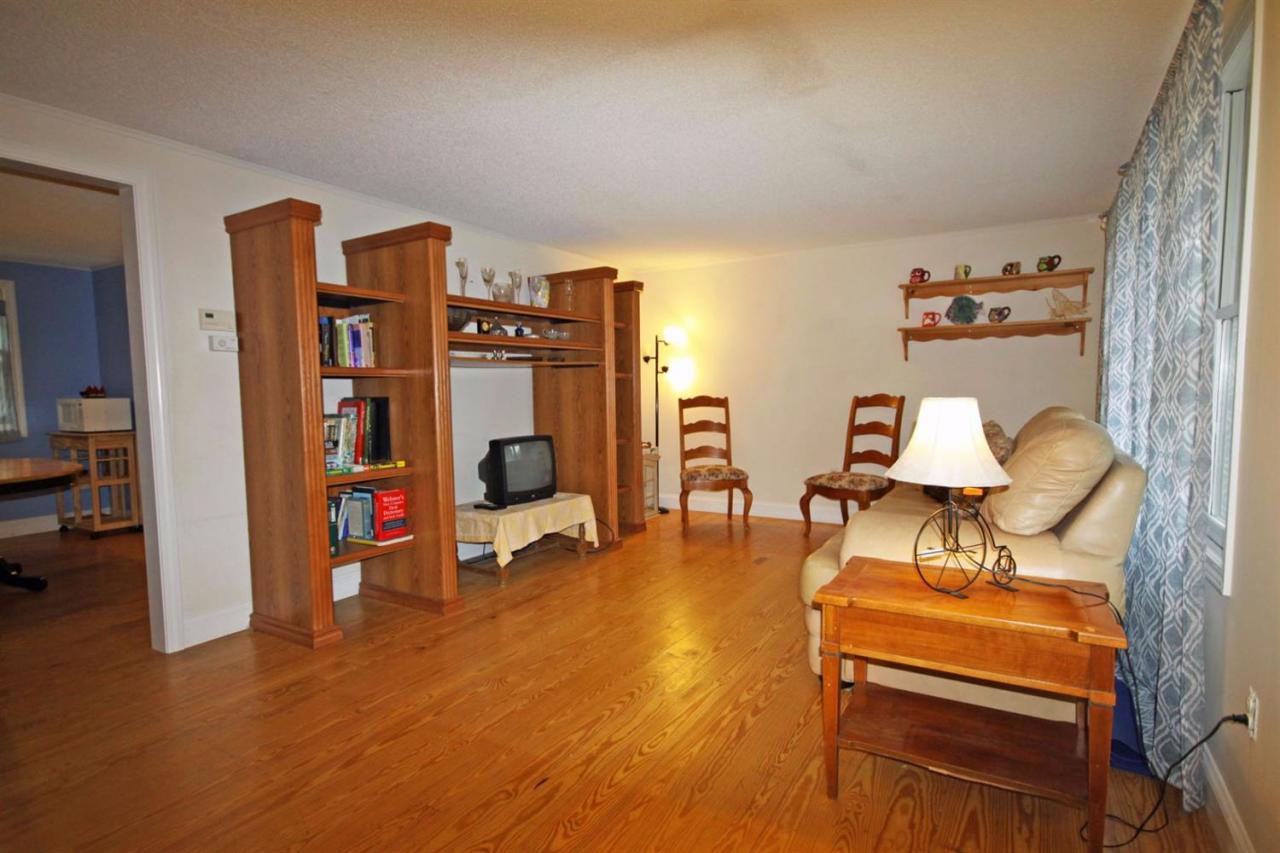 140 Captain Samadrus Road Cotuit, MA 02635 - Photo 9 of 18 a living room with furniture and wooden floor