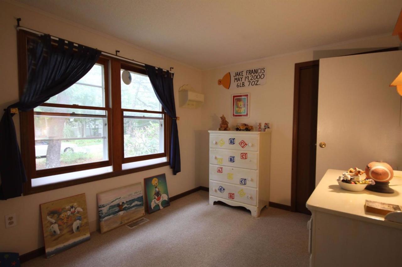 140 Captain Samadrus Road Cotuit, MA 02635 - Photo 10 of 18 a room with toys and a window