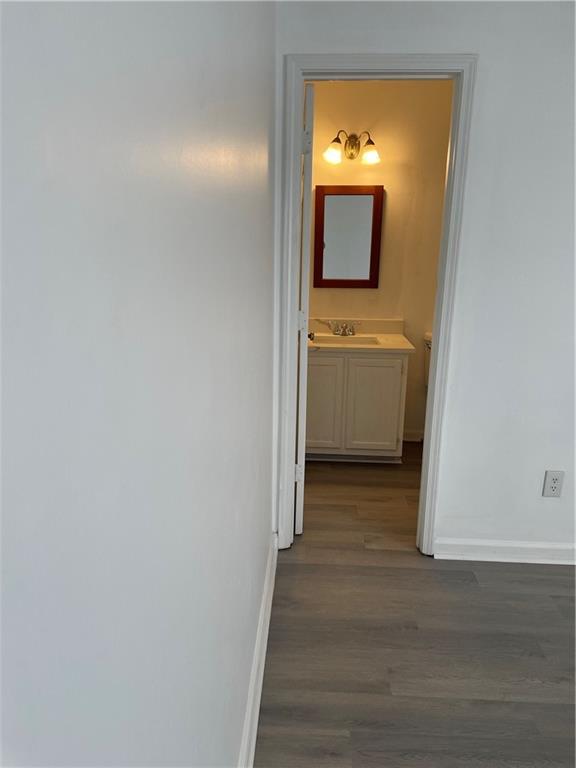167 Walter Way Stone Mountain, GA 30083 - Photo 14 of 21 a view of a hallway with a white door and a bathroom