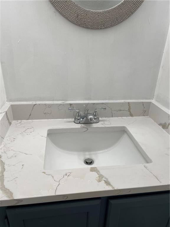 167 Walter Way Stone Mountain, GA 30083 - Photo 16 of 21 a bathroom with a sink and a mirror