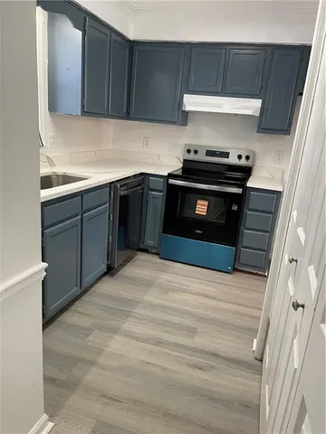 a kitchen with a stove and a microwave