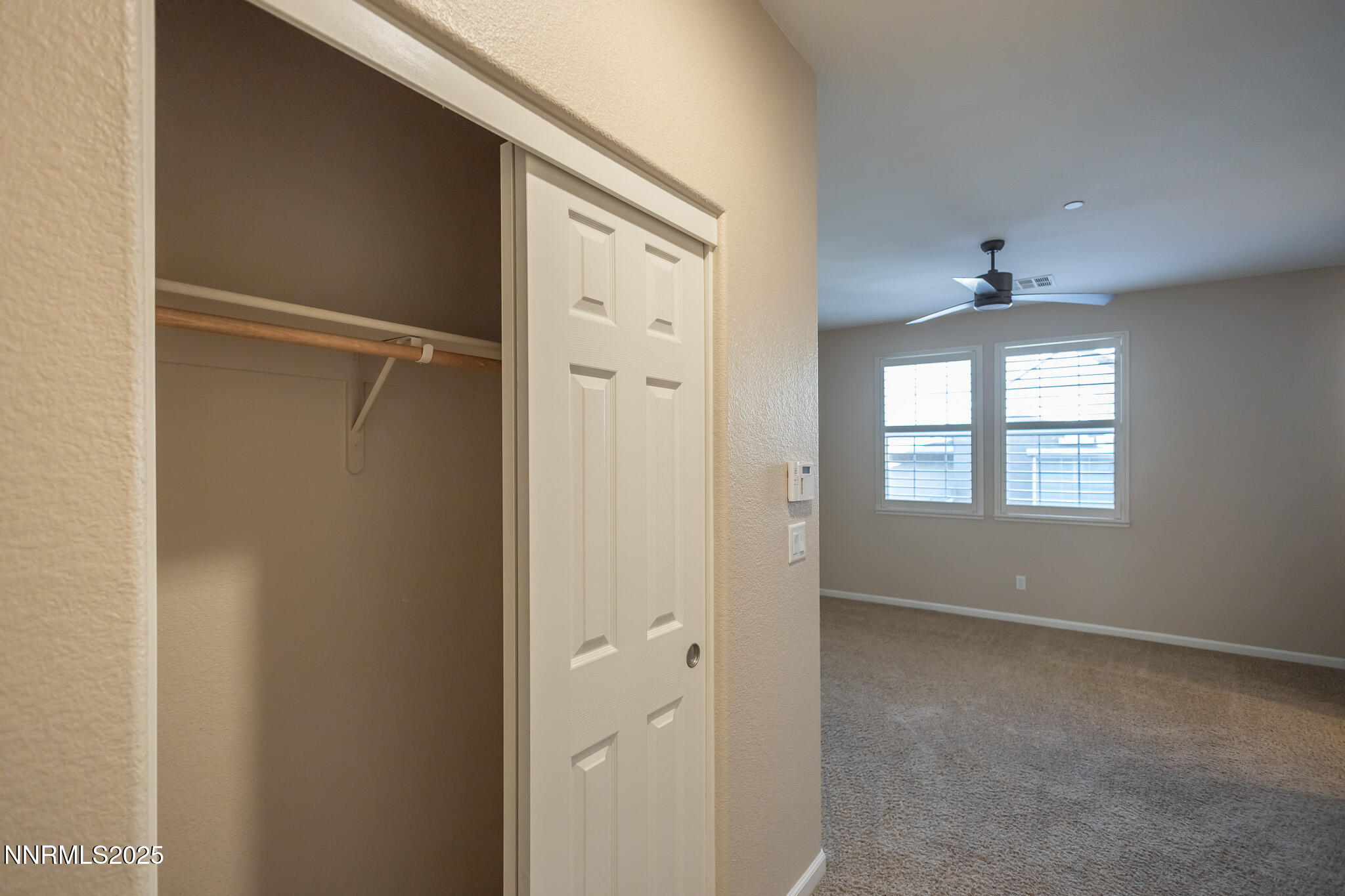 1715 Dark Horse Road, Unit B Reno, NV 89521 - Photo 20 of 39 a view of an empty room with a window