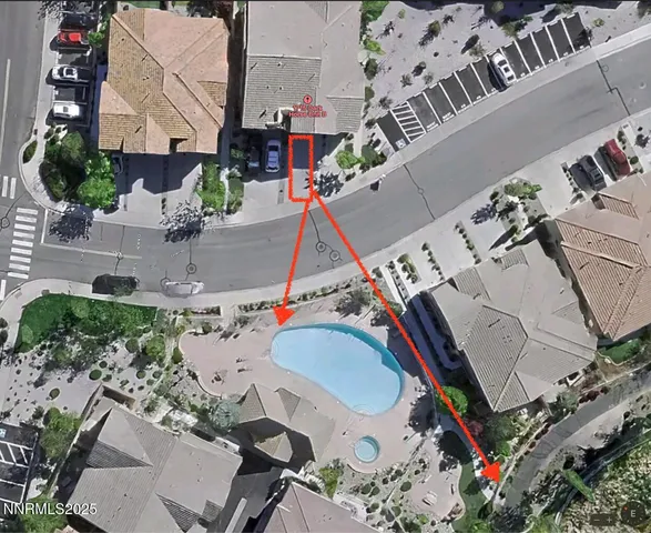 an aerial view of a house with a swimming pool